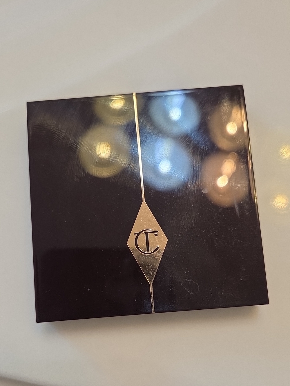 Charlotte Tilbury Black Compact with Gold CT Emblem